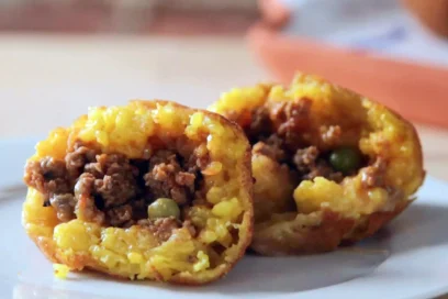 Rice ball cut open to reveal a savory filling